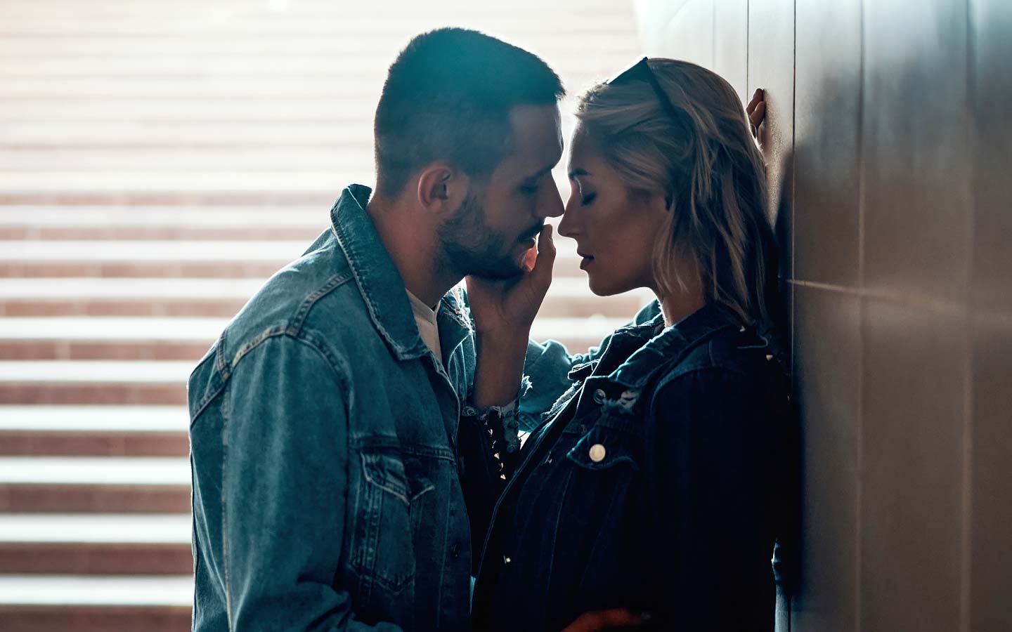 Man and woman about to kiss